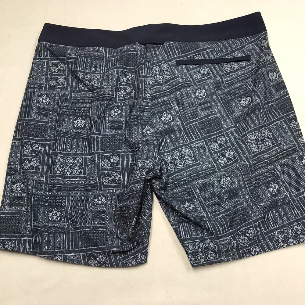 RHONE R&R Swim Trunks Men 38 Blue Floral Print Poly Stretch Mesh Lined